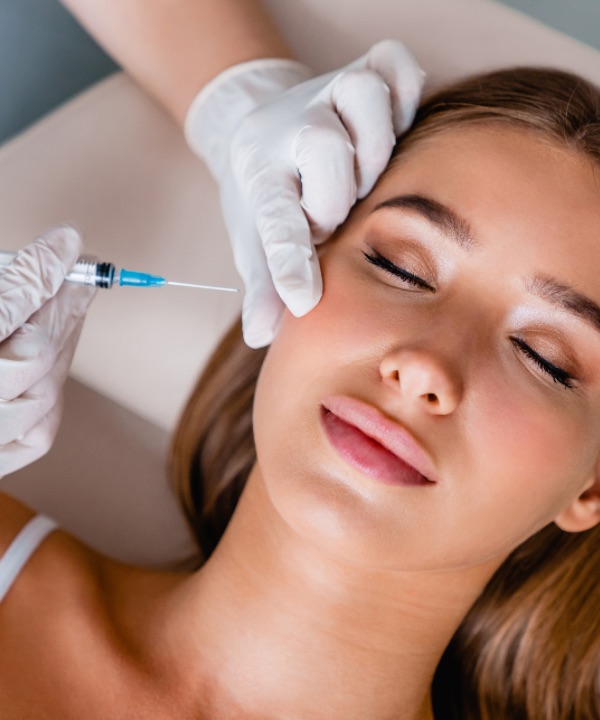 Young woman gets facial injections